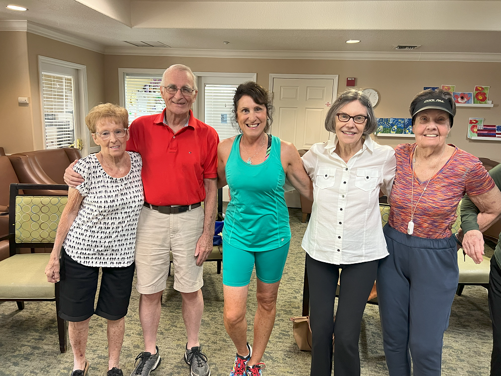 Leslie Sokol with her students at Aegis Living after a fun workout.